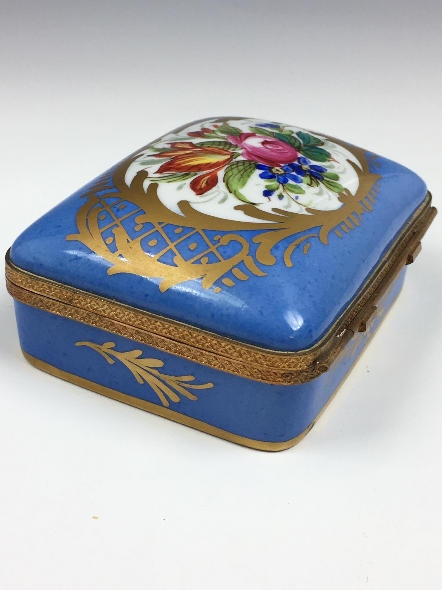 A French porcelain and gilt metal box, 20th century, painted with a floral reserve with gilt - Image 21 of 22