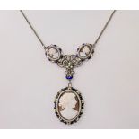 A French silver, enamel and shell cameo necklace, early 20th century, the oval cameo of a