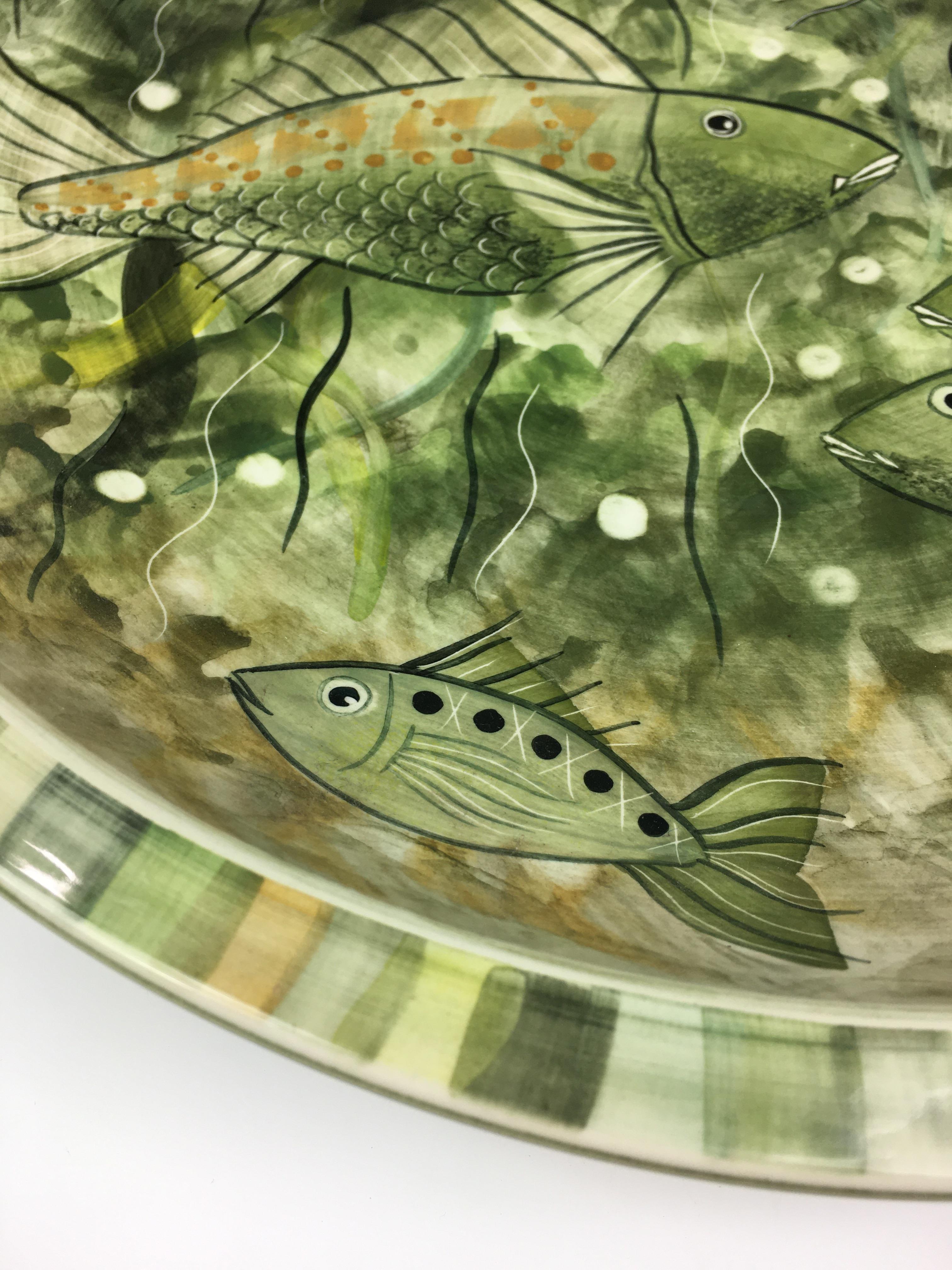 A large Jersey Pottery fish dish, of circular form, the flat rim dish, decorated with fish amidst - Image 5 of 7