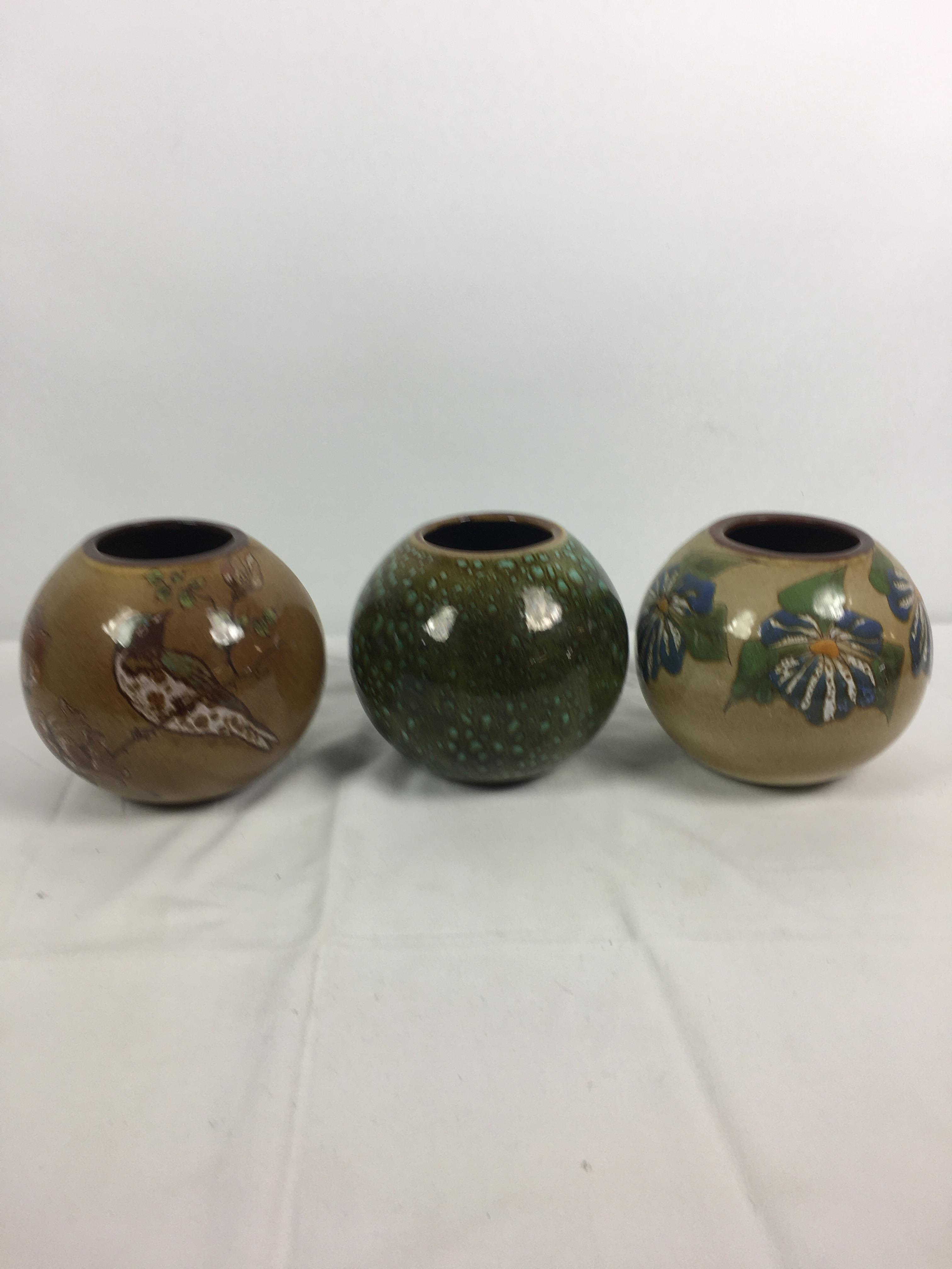 Three Guernsey pottery vases, each of globular form, one decorated with bird and flowers on - Image 2 of 8