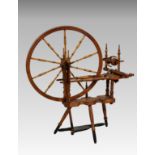 A Norwegian mid-19th century pine and fruitwood spinning wheel, believed to have been made in