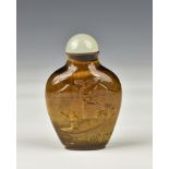 A Chinese carved tiger's eye snuff bottle, of high shouldered, flattened ovoid form, carved with a