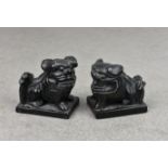 A matched pair of miniature argillite dogs of Fo, probably 20th century, the largest measuring 1 7/