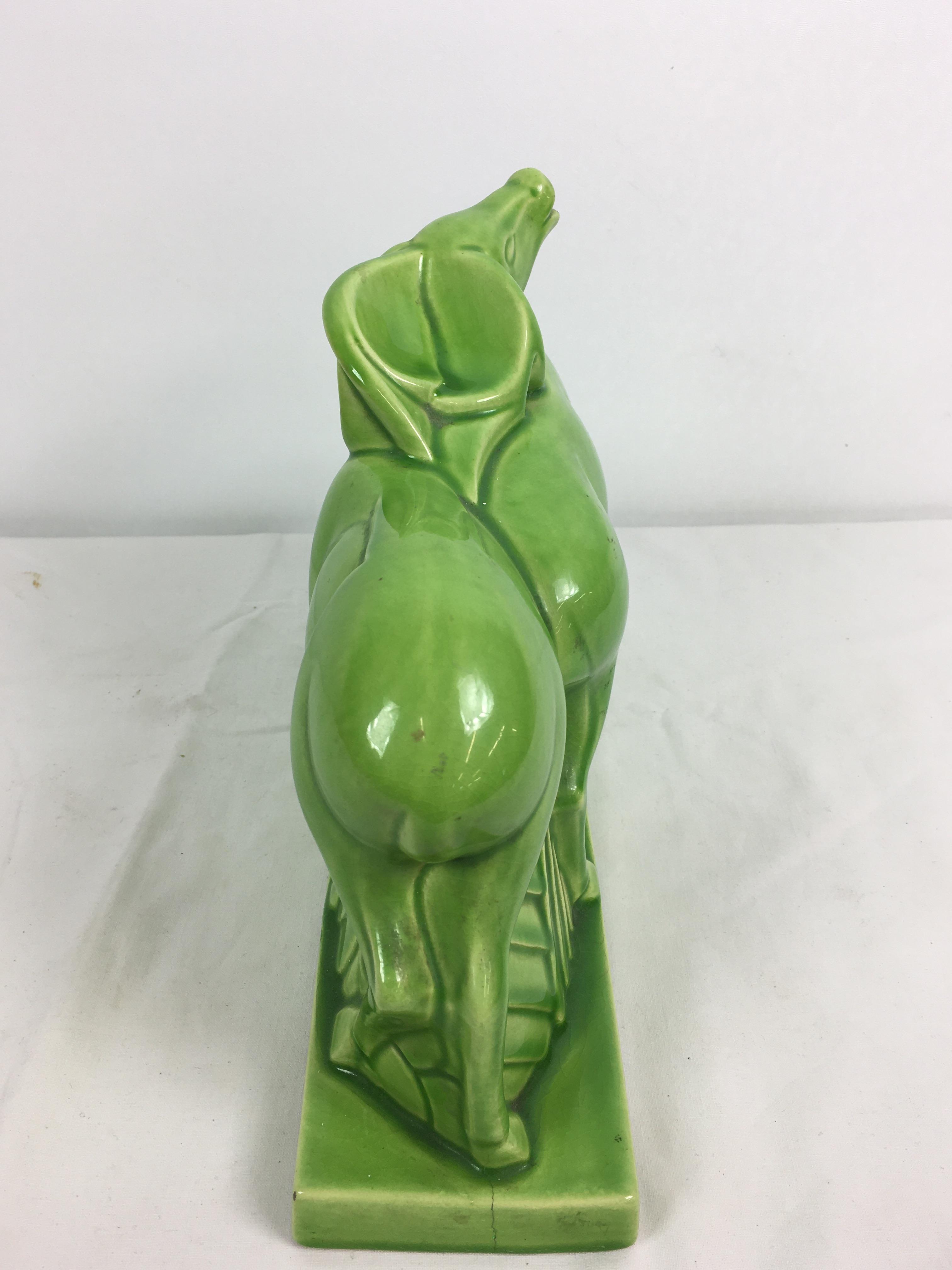 Charles Lemanceau - A French Art Deco green glazed pottery figure group of two stylized buffalo or - Image 8 of 11