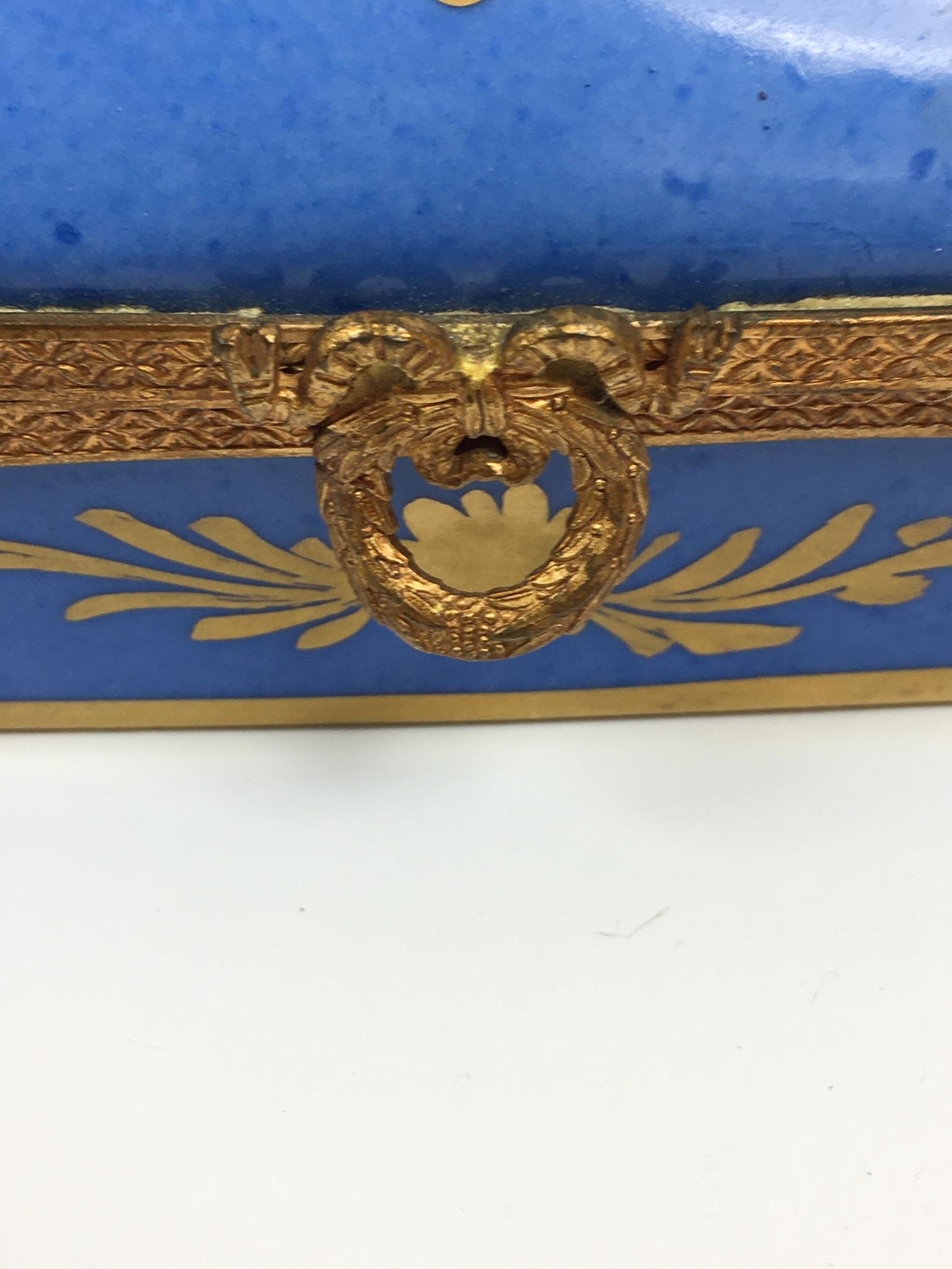 A French porcelain and gilt metal box, 20th century, painted with a floral reserve with gilt - Image 18 of 22