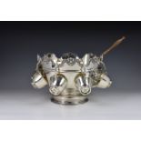 An Elizabeth II silver Monteith punch bowl and a set of eight Channel Islands silver punch cups by