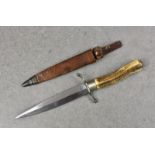 A German Officers fighting knife, World War I or later, having horn handle and nickel fittings,
