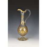 A Victorian cut glass, gilt decorated claret jug, of neo-classical form, the body with panel cut
