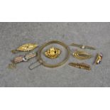 Seven silver and gold vintage brooches, including a 15ct gold, ruby and seed pearl pierced bar