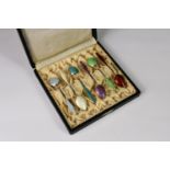 A cased set of six Norwegian silver and enamel demitasse spoons, by Gustav Hellstrom, the shaped