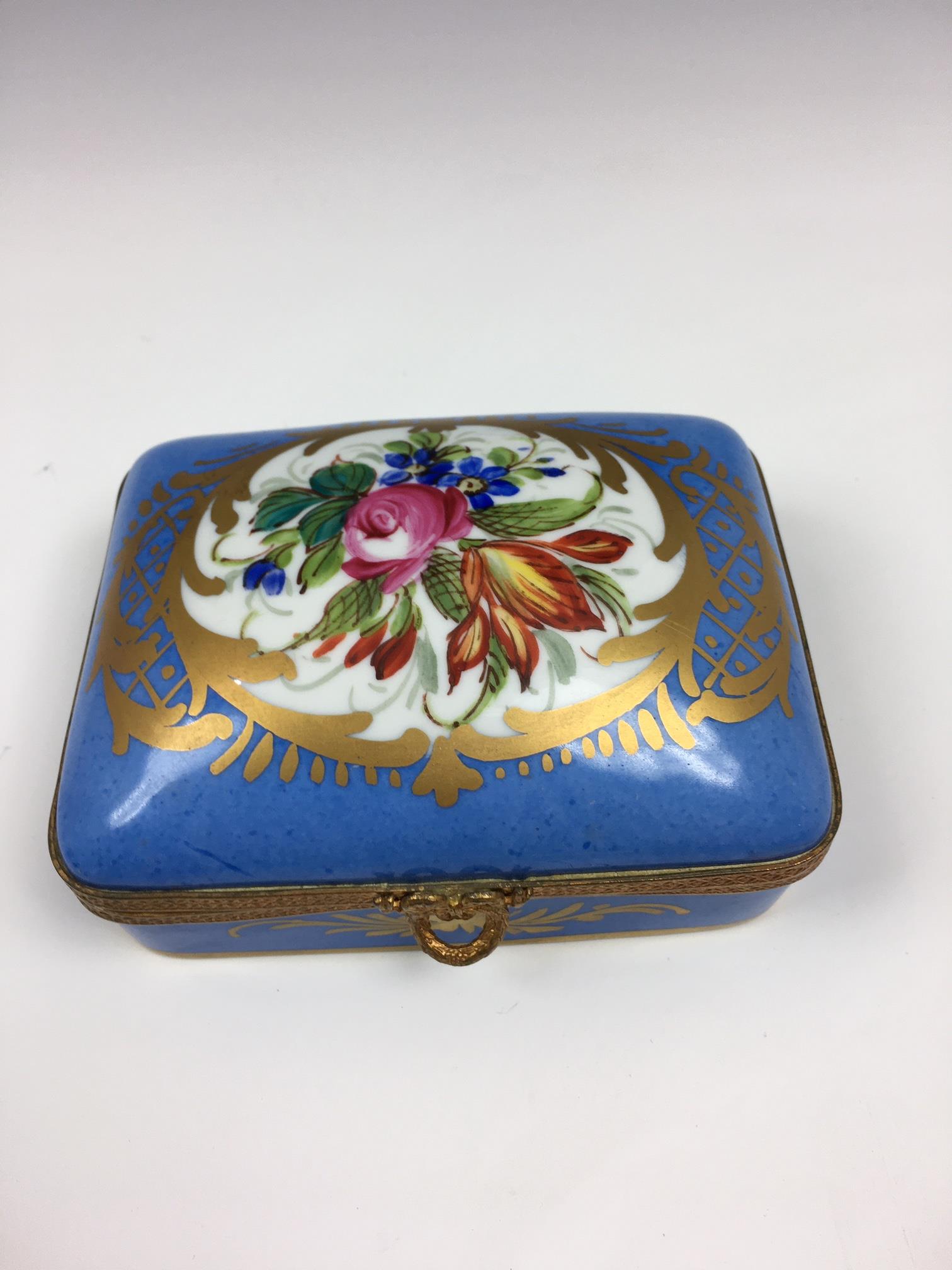 A French porcelain and gilt metal box, 20th century, painted with a floral reserve with gilt - Image 17 of 22