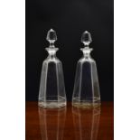 A pair of Victorian hexagonal tapered glass decanters, each angle with repeating ribbed