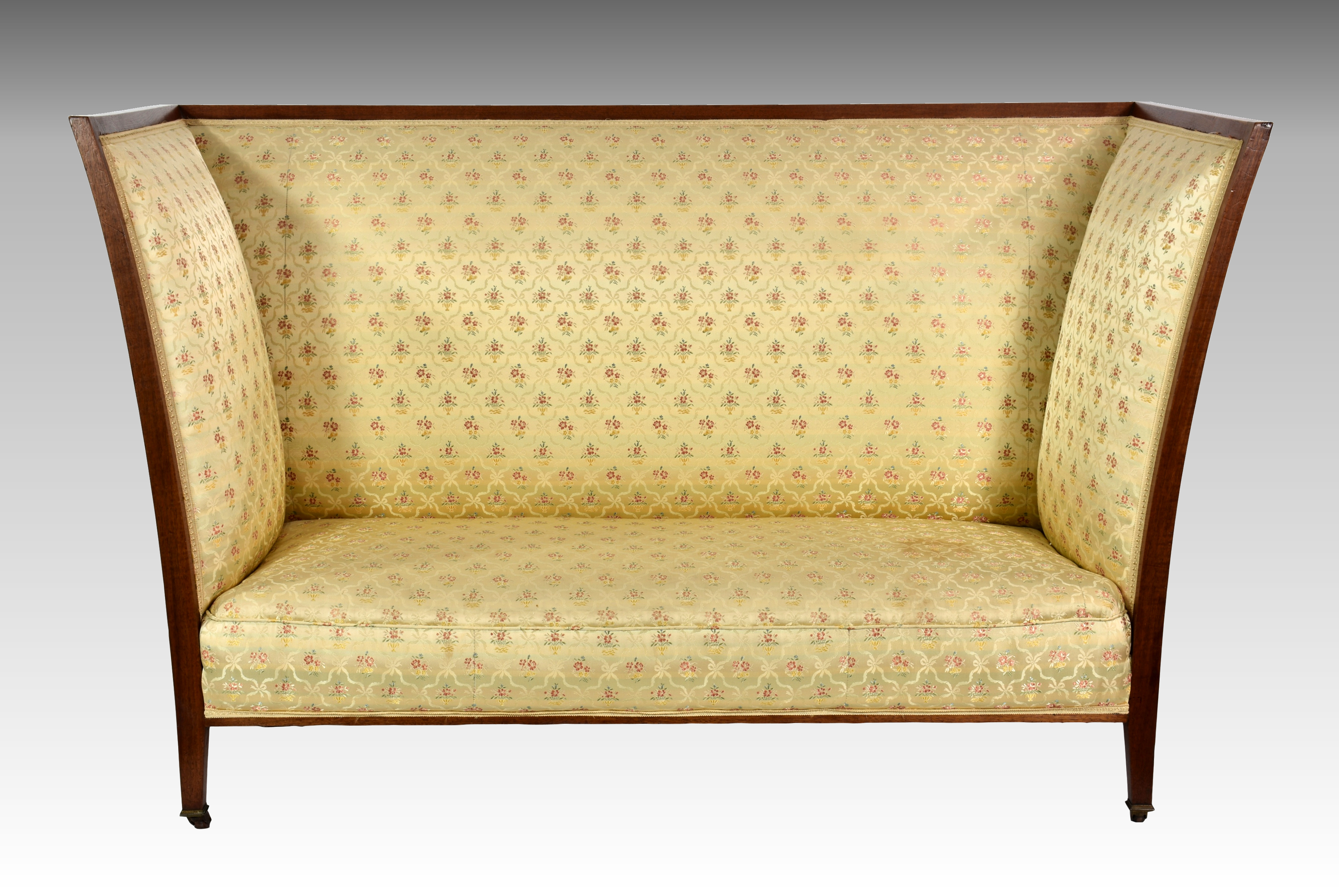 George Henry Walton - an Arts & Crafts walnut framed high backed settee, c.1900-1910, the angular