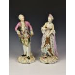 A pair of large German porcelain male and female figurines, late 19th / early 20th century,