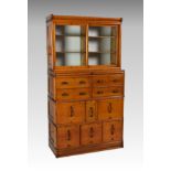 A Globe Wernicke honey oak filing cabinet bookcase, early 20th century, the glazed top with two