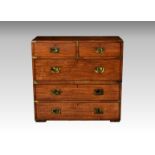 A mid-19th century brass bound teak two-part campaign chest, with two short over three long drawers,