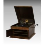 An oak cased ' His Masters Voice ' model 103 table-top gramophone, the hinged front doors opening to