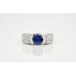 A 1.5ct oval sapphire, diamond and white gold ring, the sapphire set into 18ct white gold with