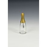 An unusual novelty Victorian glass glue pot, 1870s, fashioned as a champagne bottle, the gilded