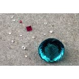 A collection of small, loose gemstones and cut glass, of white, pink and turquoise colouring.