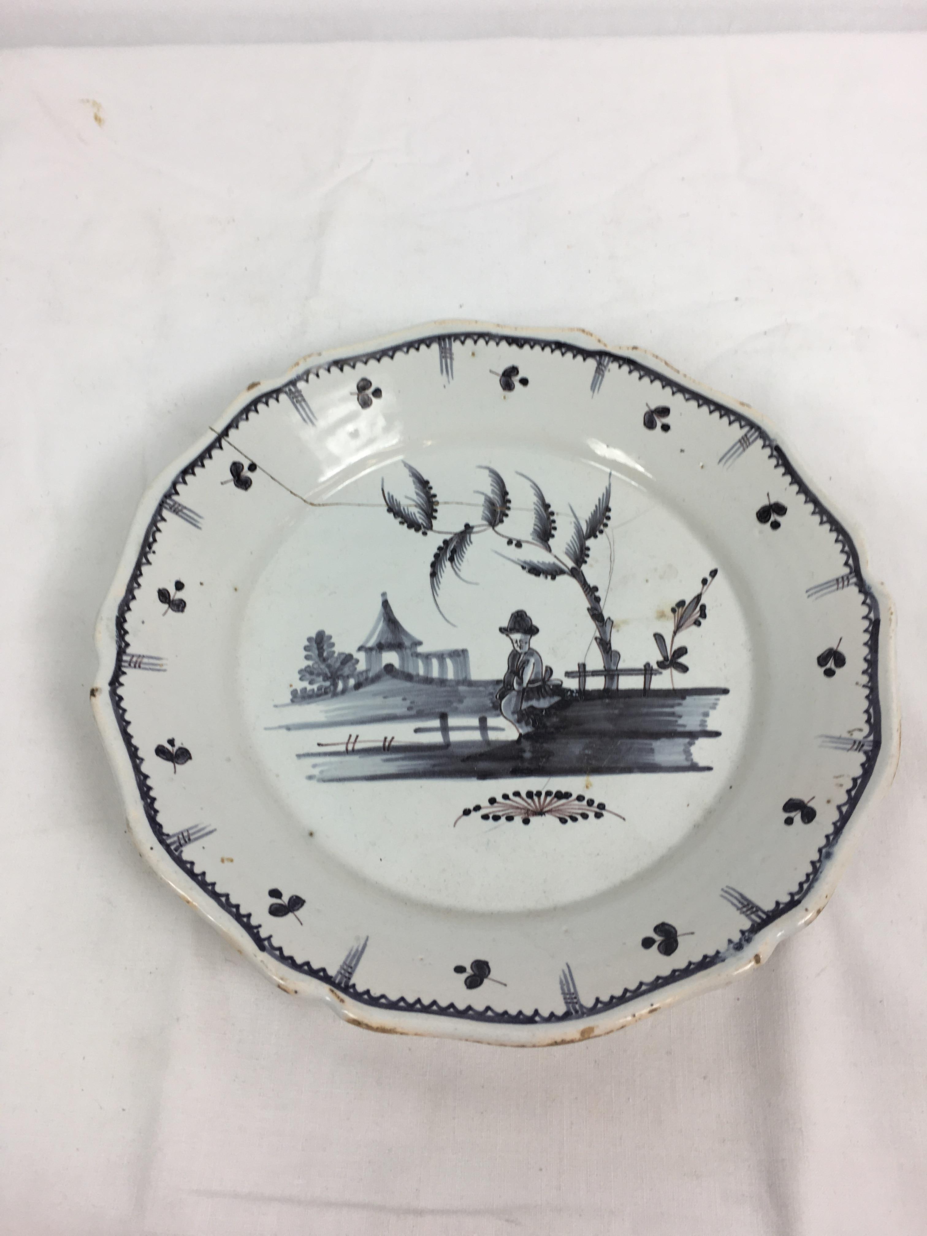 A Delft blue and white charger, the centre decorated with houses and a pair of swans, 13¼in. (33. - Image 2 of 9