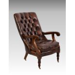 An early 19th century style mahogany and leather slipper back armchair, the reclined, buttoned