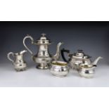 A Victorian silver plate coffee pot, of compressed bombe form, raised on stepped circular foot,