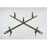 A trench art cross bayonet wall hanging hat rack, 26in. (66cm.) wide.