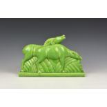 Charles Lemanceau - A French Art Deco green glazed pottery figure group of two stylized buffalo or
