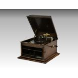 A oak cased Columbia 117 table-top gramophone, the tilt turn front facade housing the sound box,