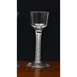 A mid-18th century airtwist wine glass, c.1750-60, the ogee bowl on a double series airtwist stem