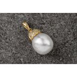 A cultured pearl and 18ct yellow gold pendant, the gold cap inset with twelve diamonds and the pearl