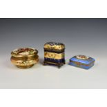 A French porcelain and gilt metal box, 20th century, painted with a floral reserve with gilt