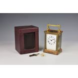 A French gilt brass carriage clock by Duverdry & Bloquel, c.1900, with corniche case, shaped handle,