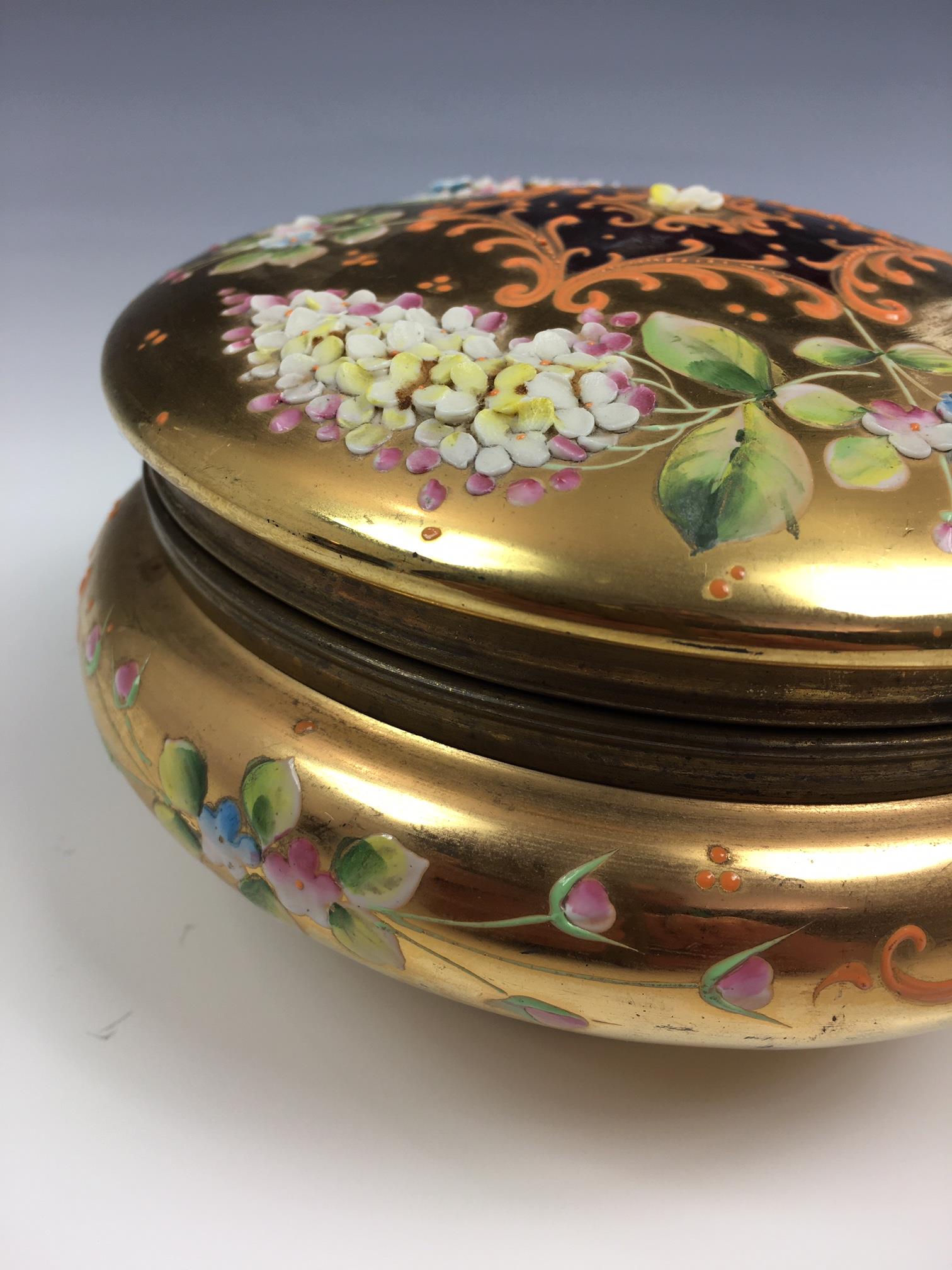 A French porcelain and gilt metal box, 20th century, painted with a floral reserve with gilt - Image 10 of 22