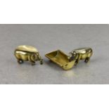 Two Edwardian novelty brass pigs - smoking related, probably French, the first fashioned standing at