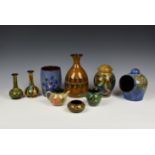 A large collection of Guernsey Pottery, decorated with floral or stylised designs on blue, green and