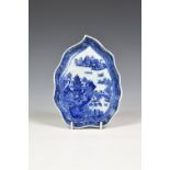A Chinese Export porcelain blue and white leaf-shaped dish, Qianlong period, painted with lake scene
