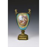 A Sevres style ormolu mounted porcelain vase lamp, early 20th century, ovoid form, the two gilt