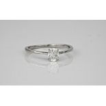 A platinum diamond solitaire ring, the oval cut diamond weighing approximately 0.46ct. Ring size