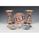 A pair of Japanese Imari trumpet vases, late 19th century, of waisted, hexagonal form, painted in