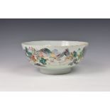An 18th century Chinese porcelain famille rose verte punch bowl, enamelled with a village in a