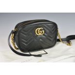 A Gucci GG Marmont Mini Crossbody Bag, in very good condition.