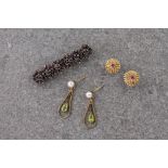 A Victorian silver gilt and garnet brooch, a pair of 14ct gold and ruby earrings and a pair of 9ct