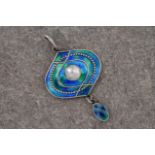 An Art Nouveau enamel and silver pendant by Murrle, Bennett & Co, the silver pendant with blue and