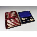 A cased set of two George V silver serving spoons, John Williams & Co, London, 1918, having shaped