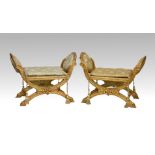 A pair of neo-classical giltwood x-frame stools, mid-20th century, the oval sides with buttoned