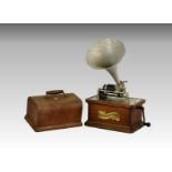 An oak cased phonograph by ' The Columbia Graphophone ' company, having matched aluminium horn,