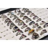 A collection of 35 silver rings (35), set with various gemstones including rubies, sapphires,