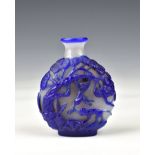 A Chinese carved cameo glass snuff bottle, probably early 20th century, of flattened ovoid form,